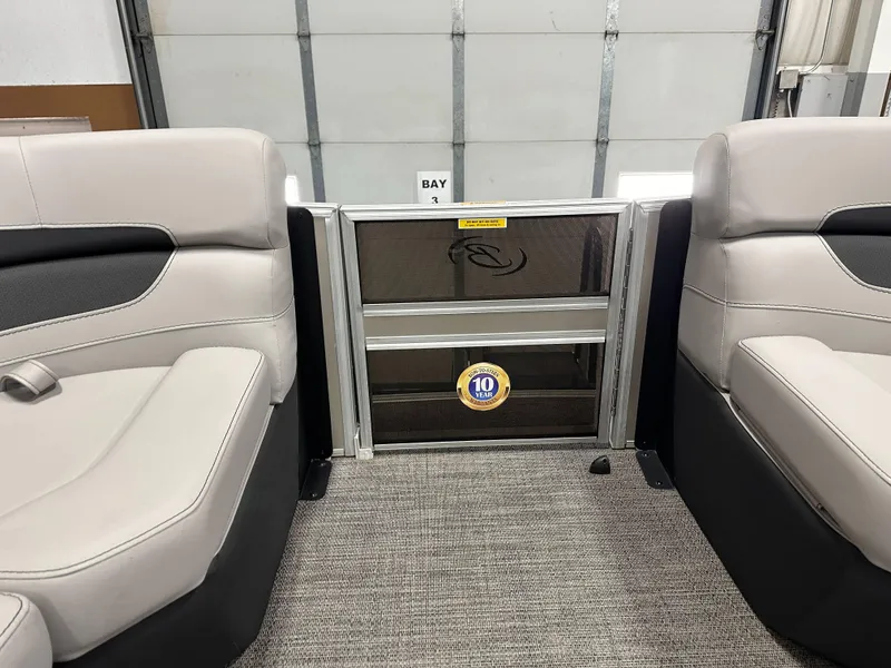 Slide: The Image of 2025 Barletta Cabrio 22QC interior with beige seating and a 10-year warranty badge. - 8