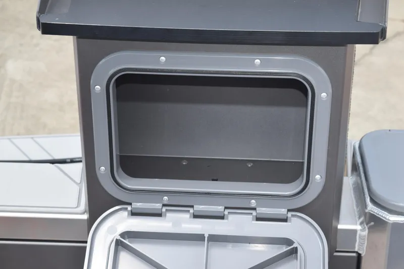 Slide: The Image of Open storage compartment on 2025 Stabicraft 1550 Frontier Profish boat. - 20