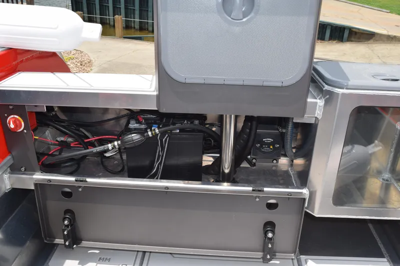 Slide: The Image of Stabicraft 1550 Frontier Profish 2025 boat interior wiring and storage compartment. - 24