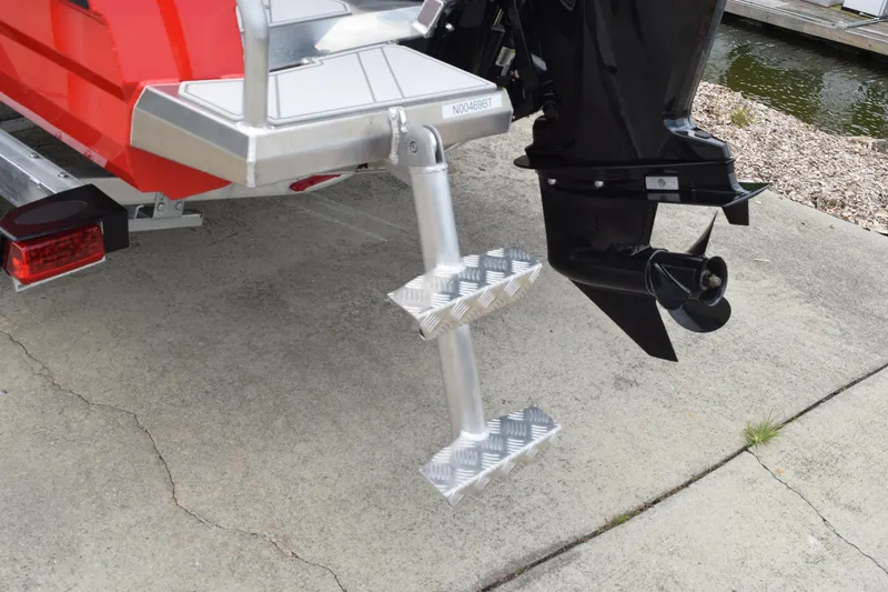 Slide: The Image of Stabicraft 1550 Frontier Profish 2025 boat with aluminum boarding ladder and outboard motor. - 7