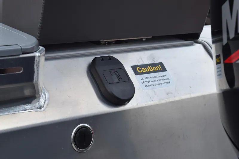 Slide: The Image of Close-up of the 2025 Stabicraft 1550 Frontier Profish fuel tank cap with caution label. - 8
