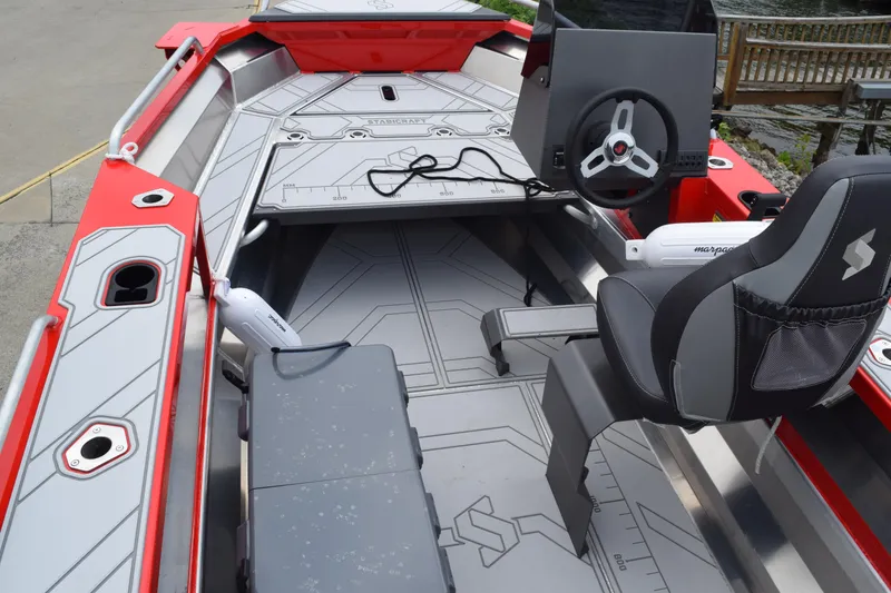 Slide: The Image of 2025 Stabicraft 1550 Frontier Profish boat interior with steering console and seating. - 9