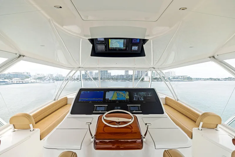 Slide: The Image of 2018 Viking 80 Convertible yacht helm with advanced navigation systems and panoramic view. - 11