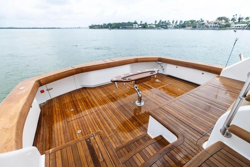 Slide: The Image of 2018 Viking 80 Convertible yacht with teak deck and fishing rod holder. - 13