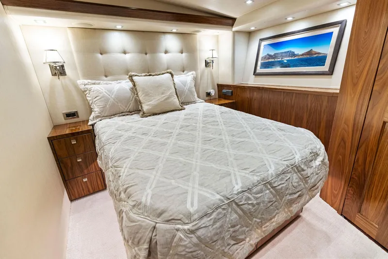 Slide: The Image of Luxurious bedroom in 2018 Viking 80 Convertible yacht with elegant bedding and wall art. - 25