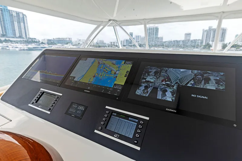 Slide: The Image of 2018 Viking 80 Convertible yacht helm with advanced navigation and monitoring systems. - 27