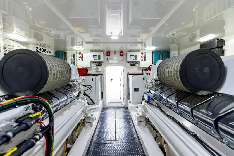 Slide: The Image of Engine room of a 2018 Viking 80 Convertible yacht with dual engines. - 28