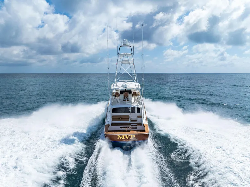 Slide: The Image of 2018 Viking 80 Convertible yacht cruising on open water. - 3