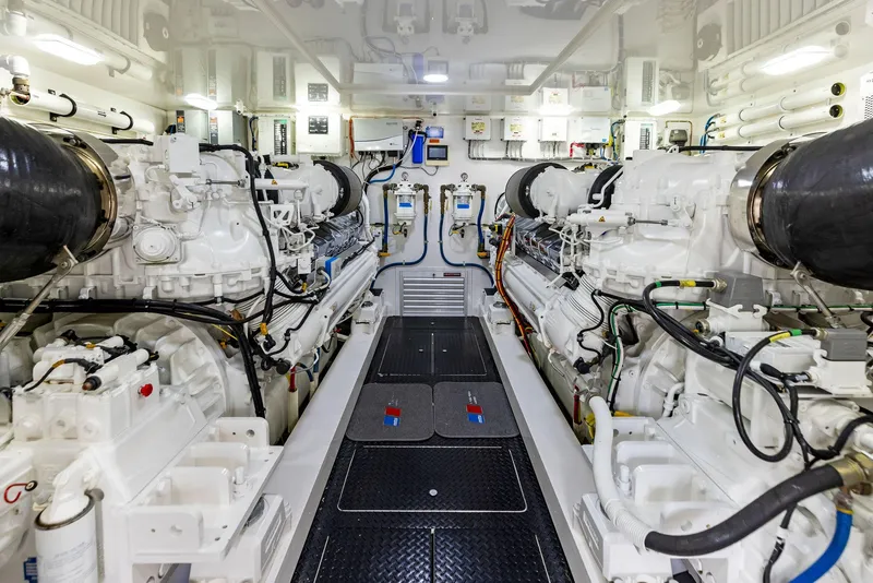 Slide: The Image of Engine room of a 2018 Viking 80 Convertible yacht with dual engines and advanced machinery. - 31
