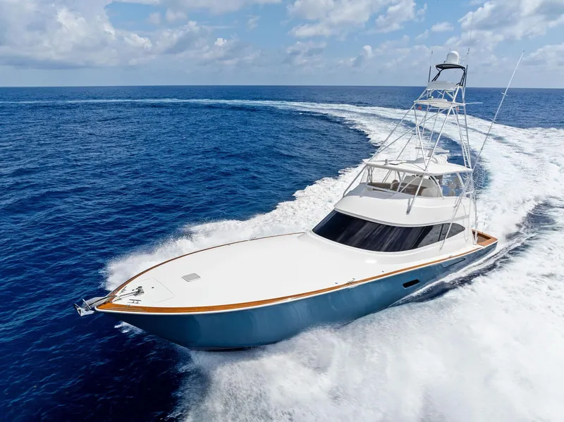 Slide: The Image of 2018 Viking 80 Convertible yacht cruising on open ocean. - 4