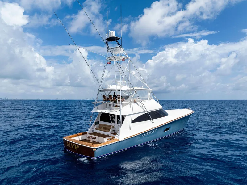 Slide: The Image of 2018 Viking 80 Convertible yacht on open ocean under blue sky. - 5