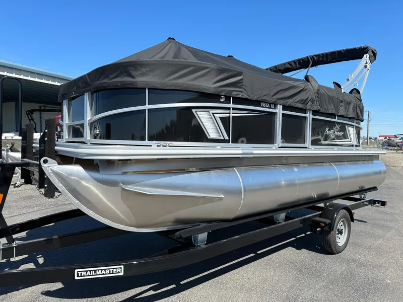 The Image of 2024 SunChaser Vista 18 Fish pontoon boat on a Trailmaster trailer. - 0
