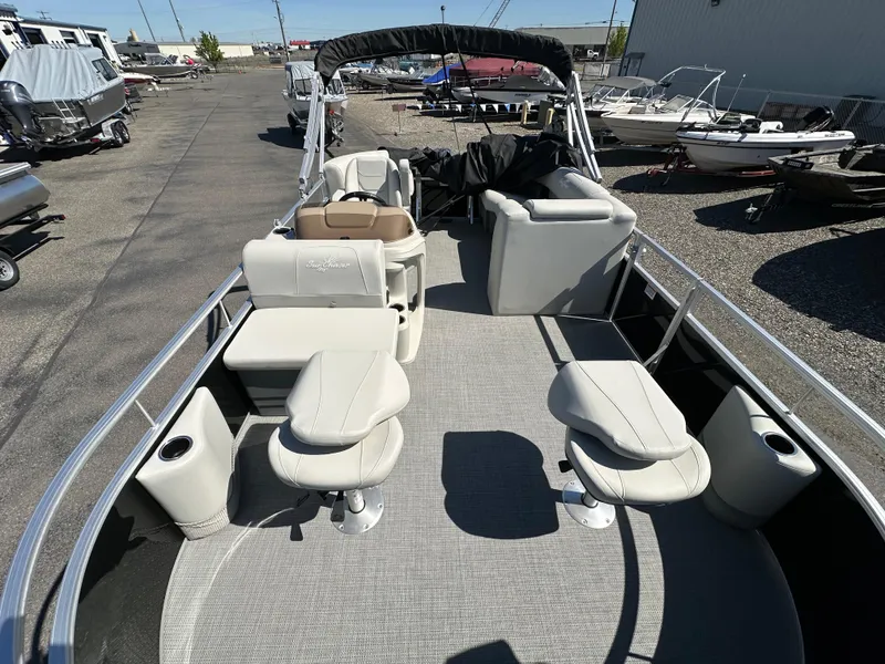 Slide: The Image of 2024 SunChaser Vista 18 Fish pontoon boat with spacious seating and fishing setup. - 4