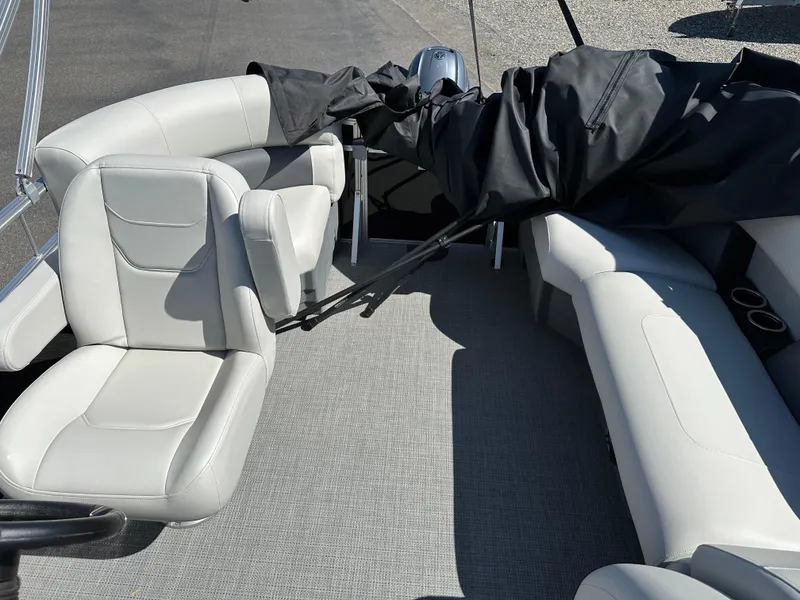 Slide: The Image of 2024 SunChaser Vista 18 Fish pontoon boat interior with plush seating and modern design. - 6