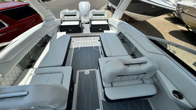 Slide: The Image of 2025 Regal LX6 boat interior with luxurious seating and modern design. - 13
