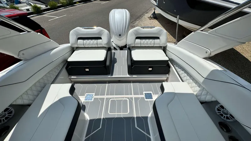 Slide: The Image of 2025 Regal LX6 boat interior with luxurious seating and modern design. - 14