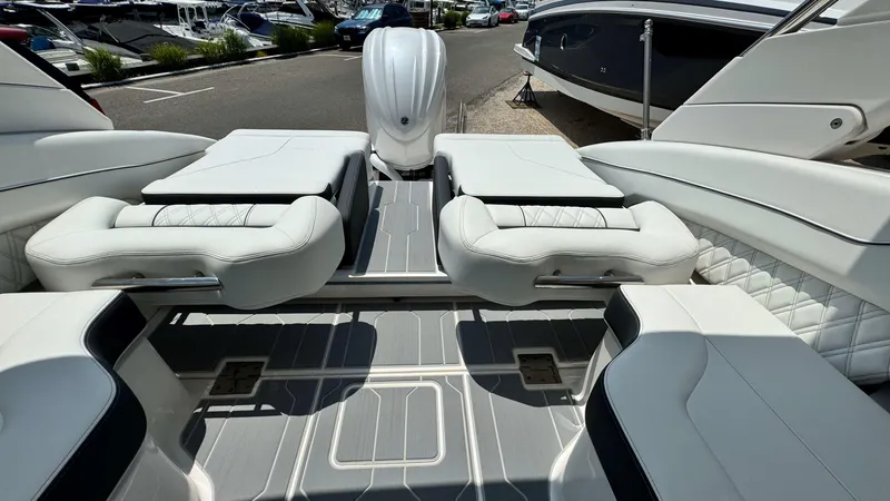 Slide: The Image of 2025 Regal LX6 boat interior with luxurious white seating and modern design. - 15