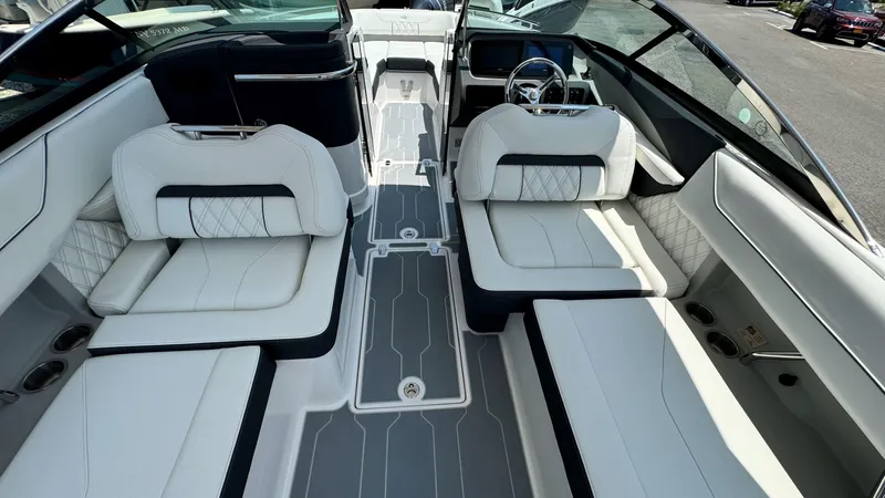 Slide: The Image of 2025 Regal LX6 boat interior with luxurious white seating and modern design. - 17