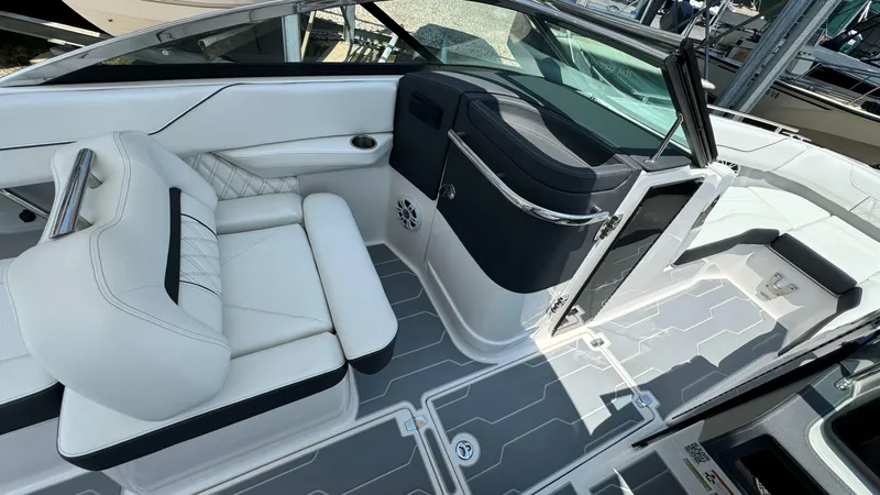 Slide: The Image of 2025 Regal LX6 boat interior with white seating and modern design. - 26