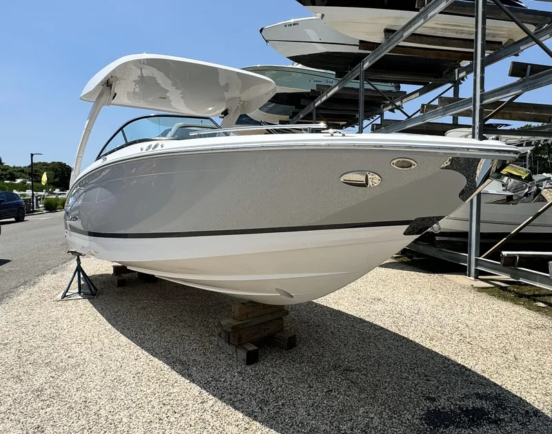 Slide: The Image of 2025 Regal LX6 boat on display in a marina. - 3