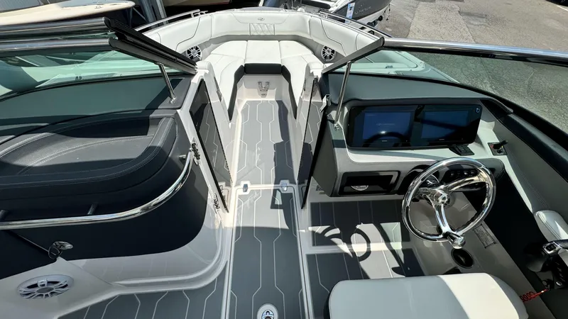 Slide: The Image of 2025 Regal LX6 boat interior with modern dashboard and seating. - 30