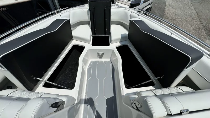 Slide: The Image of 2025 Regal LX6 boat interior with open storage compartments. - 32