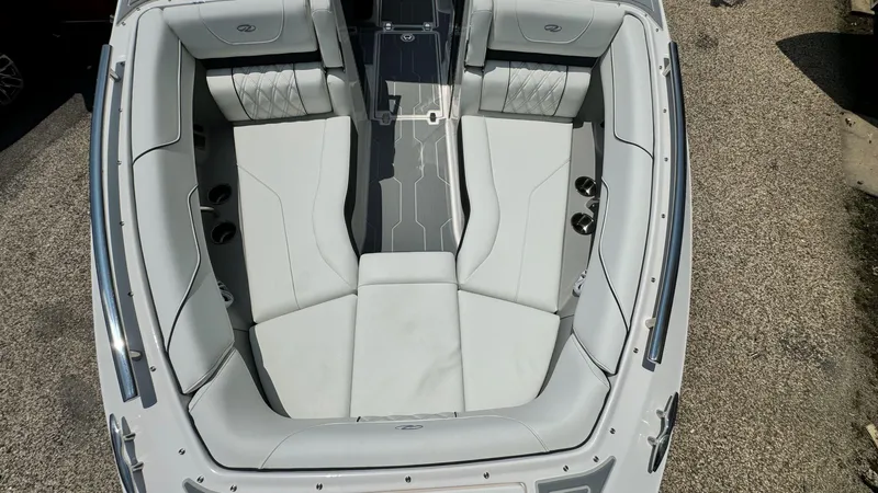 Slide: The Image of 2025 Regal LX6 boat interior with spacious seating and modern design. - 36