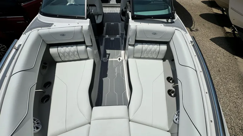 Slide: The Image of 2025 Regal LX6 boat interior with luxurious white seating and modern design. - 37