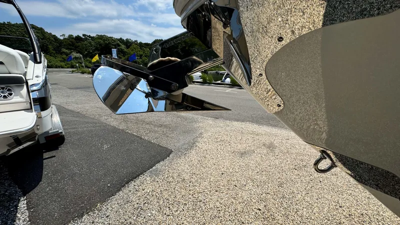 Slide: The Image of Close-up of a 2025 Regal LX6 boat propeller in a parking lot. - 38