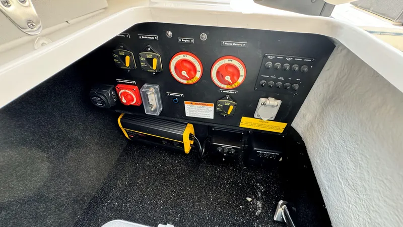 Slide: The Image of Control panel of 2025 Regal LX6 boat with various switches and dials. - 40
