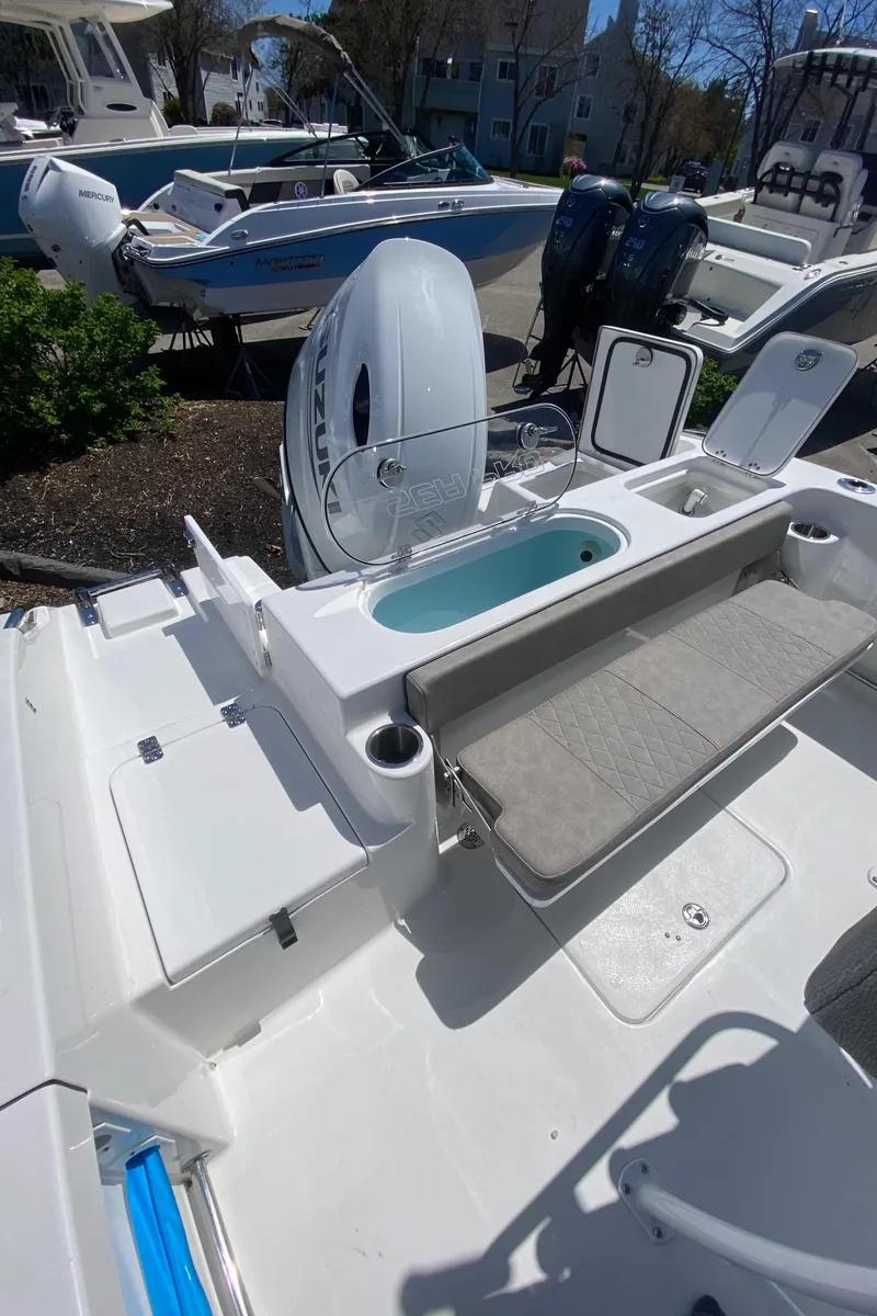Slide: The Image of 2024 Sea Pro 222 Center Console boat with seating and storage compartments. - 5