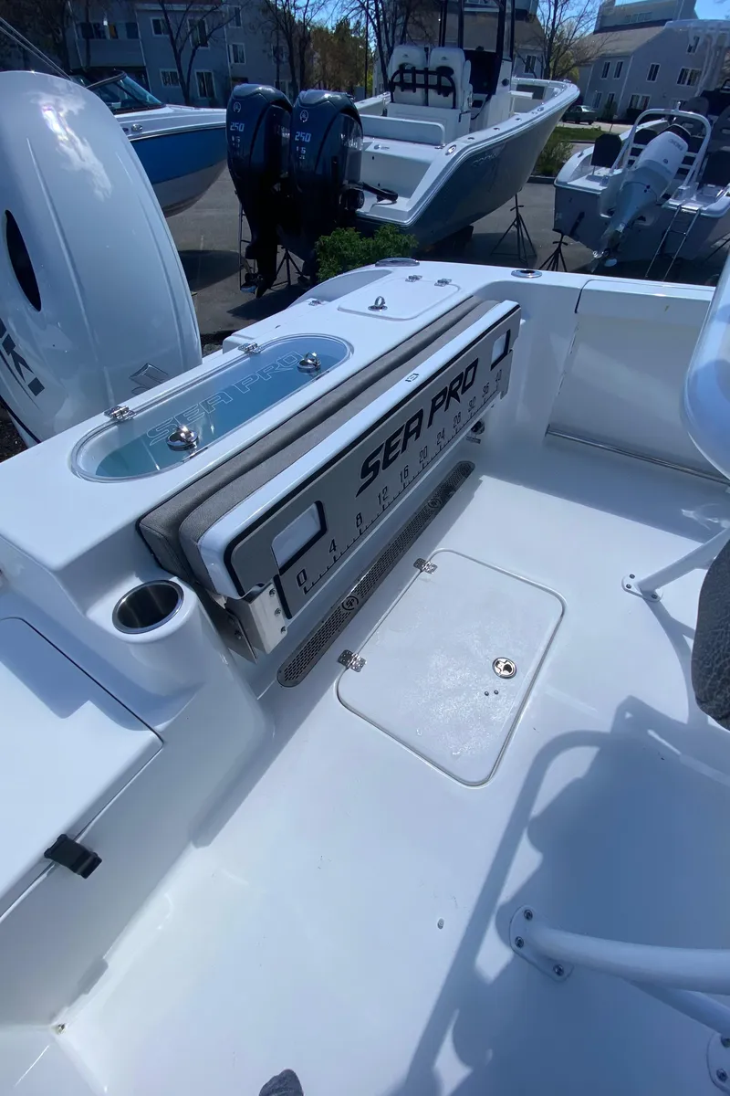 Slide: The Image of 2024 Sea Pro 222 Center Console boat interior with storage and seating. - 6