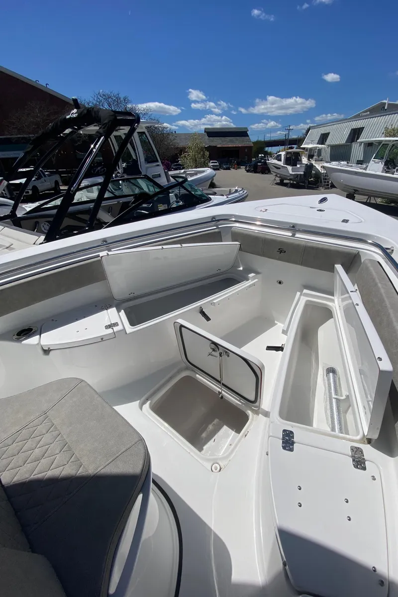 Slide: The Image of 2024 Sea Pro 222 Center Console boat with open storage compartments. - 9