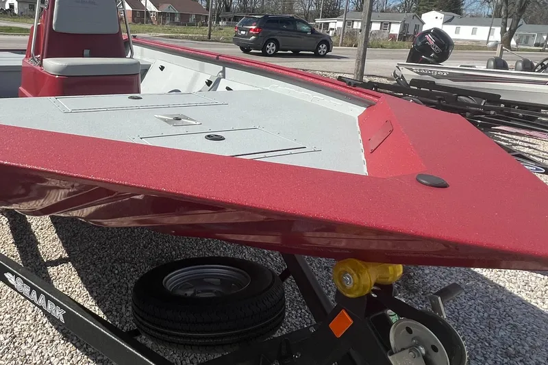 Slide: The Image of 2024 SeaArk 872 RX boat with red and gray deck on a trailer. - 10