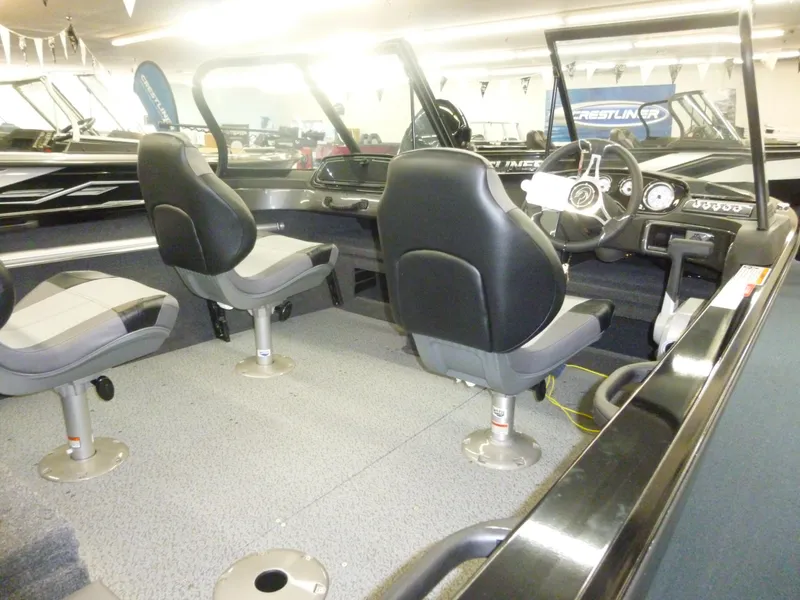 Slide: The Image of 2024 Crestliner 1750 Hawk WT w/ Jumpseat interior, featuring spacious seating and modern dashboard. - 6