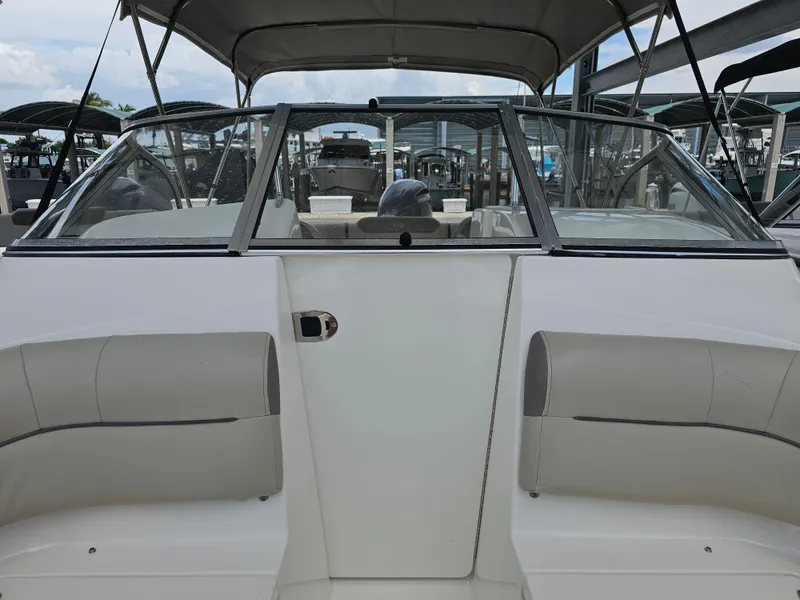Slide: The Image of 2021 Key West 239 DFS boat interior with windshield and seating. - 11
