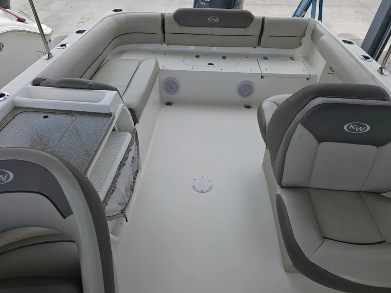 Slide: The Image of 2021 Key West 239 DFS boat interior with seating and storage compartments. - 12