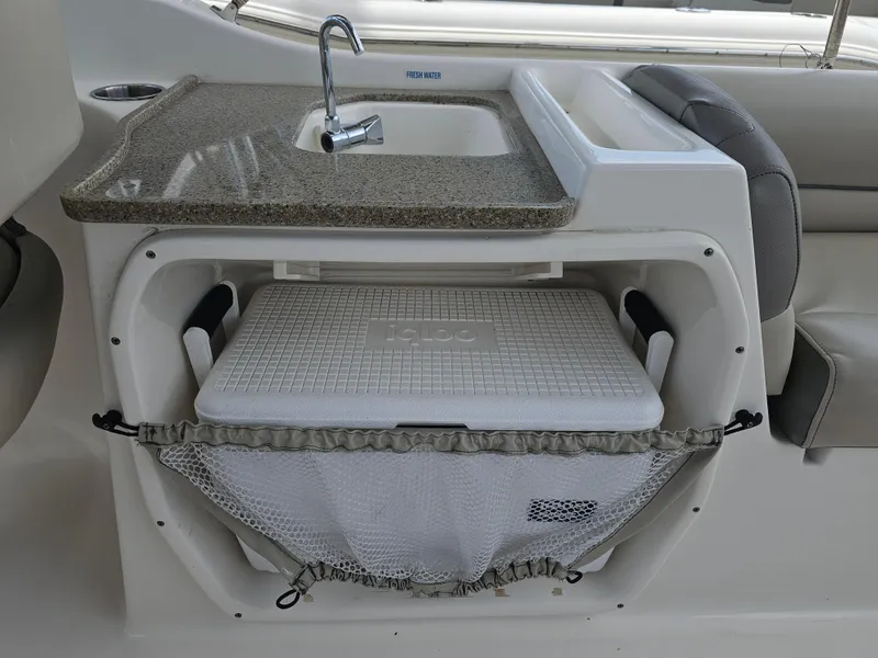 Slide: The Image of Key West 239 DFS 2021 boat sink and cooler storage area. - 17