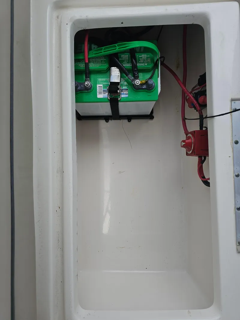 Slide: The Image of Battery compartment of a 2021 Key West 239 DFS boat with wiring. - 18