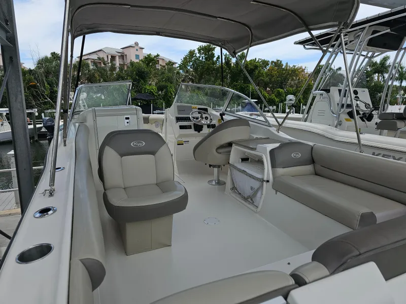 Slide: The Image of 2021 Key West 239 DFS boat interior with seating and console. - 2