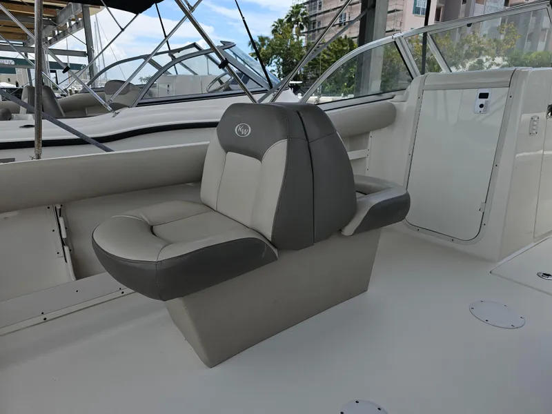 Slide: The Image of 2021 Key West 239 DFS boat interior with cushioned seating. - 21