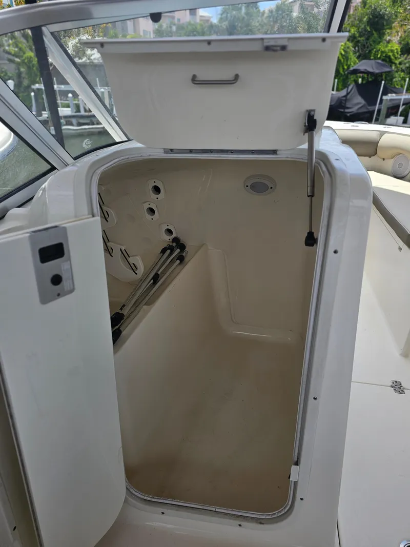 Slide: The Image of Open storage compartment on a 2021 Key West 239 DFS boat. - 22