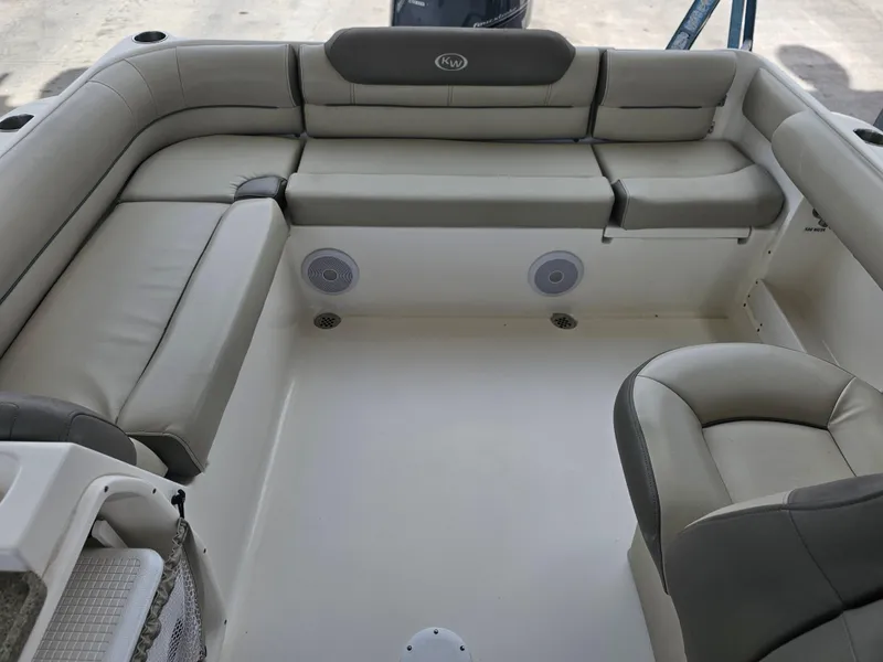 Slide: The Image of 2021 Key West 239 DFS boat interior with cushioned seating and built-in speakers. - 23