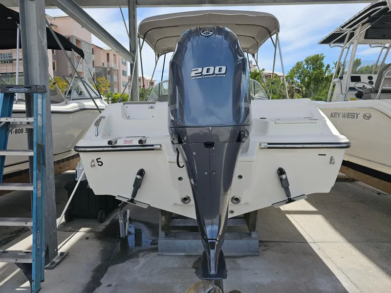 Slide: The Image of 2021 Key West 239 DFS boat with Yamaha 200 engine in marina. - 3