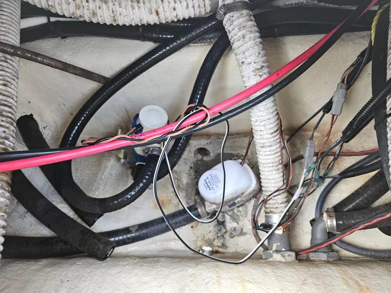 Slide: The Image of Wiring and hoses inside a 2021 Key West 239 DFS boat. - 31