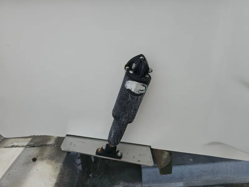 Slide: The Image of Close-up of a 2021 Key West 239 DFS boat's trim tab actuator. - 38
