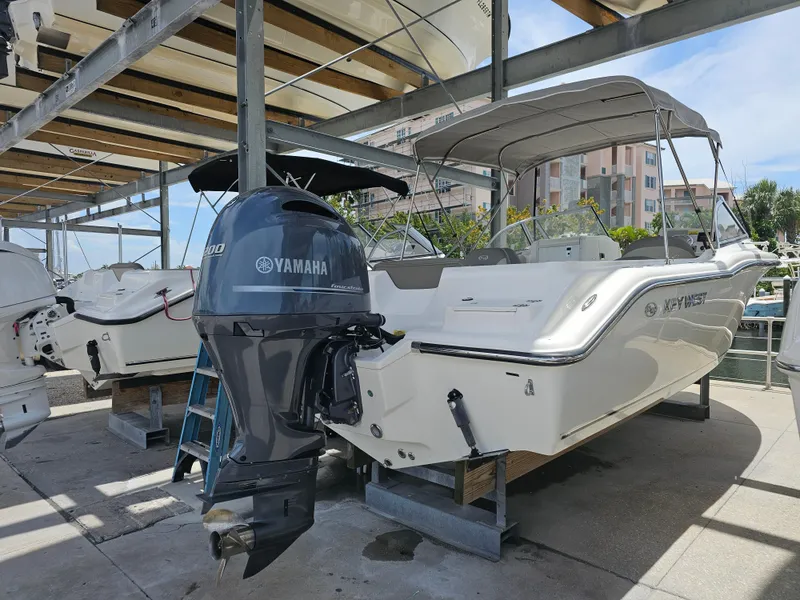 Slide: The Image of 2021 Key West 239 DFS boat with Yamaha outboard motor in marina storage. - 4