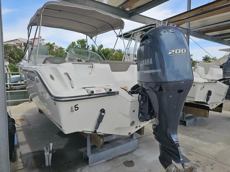 Slide: The Image of 2021 Key West 239 DFS boat with Yamaha 200 outboard motor in marina. - 6