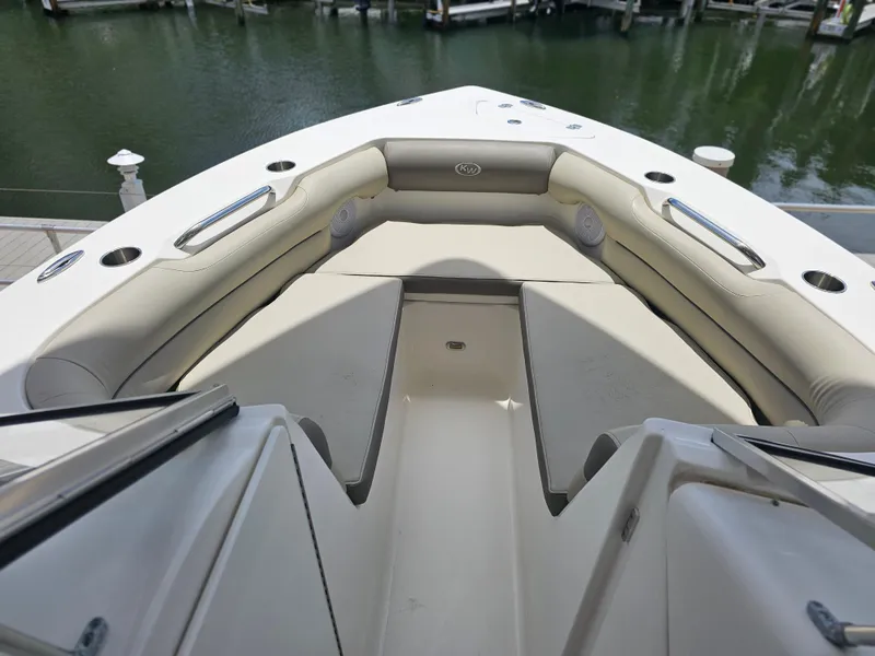 Slide: The Image of 2021 Key West 239 DFS boat interior with cushioned seating and cup holders. - 9