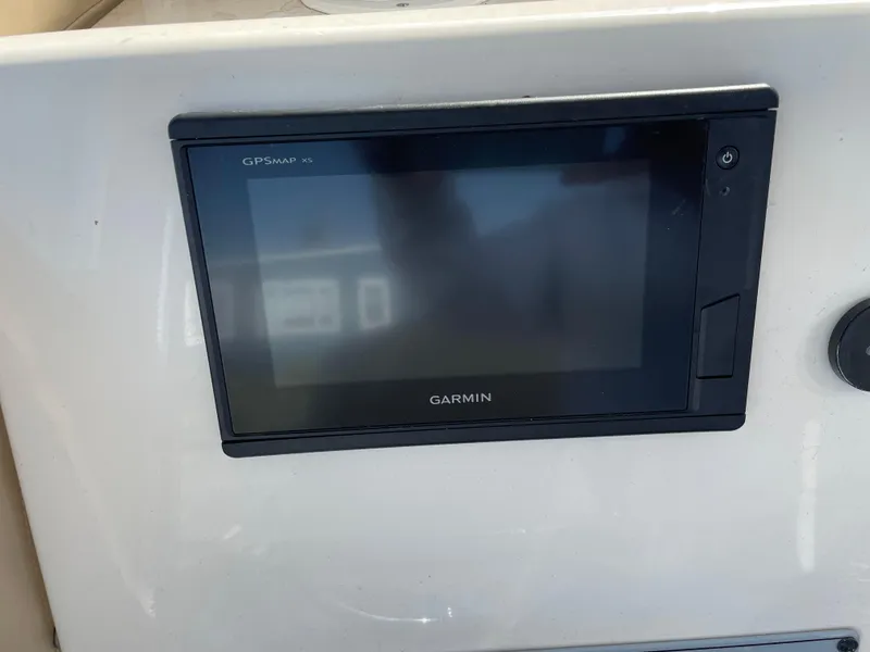 Slide: The Image of Garmin GPS display on 2018 Key West 219 FS boat dashboard. - 2